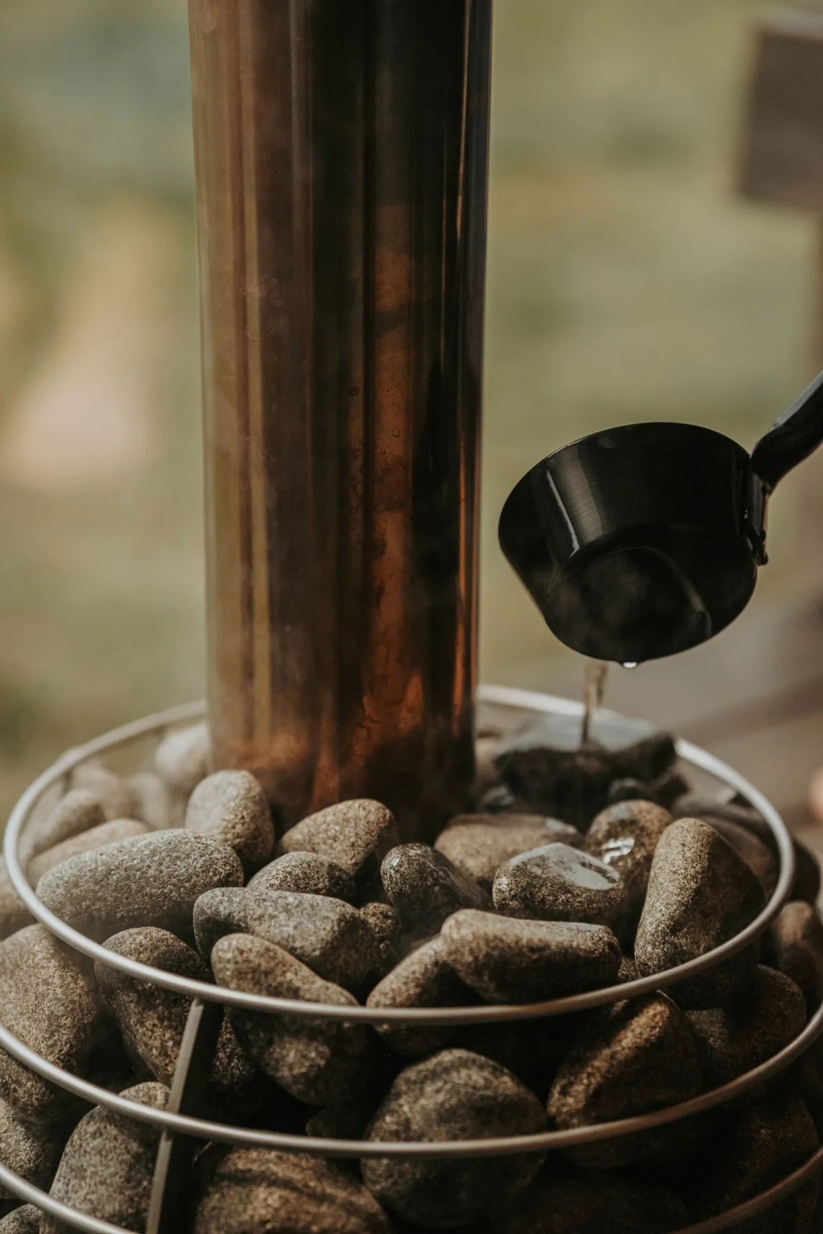 A sauna heater stacked with stones